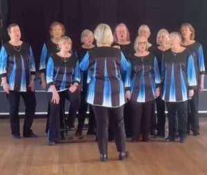 Performing at Knaphill Care Afternoon Tea Party, March 2026